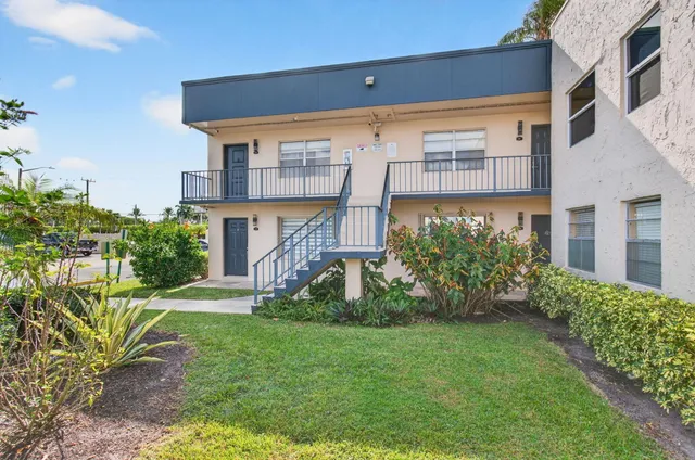 a living room with lots of furniture and a chandelier