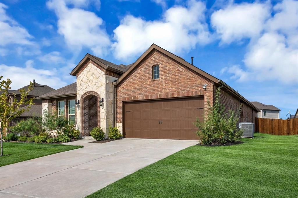 3106 Maverick Drive Forney, TX 75126 - Photo 3 of 32 a front view of house with yard and green space