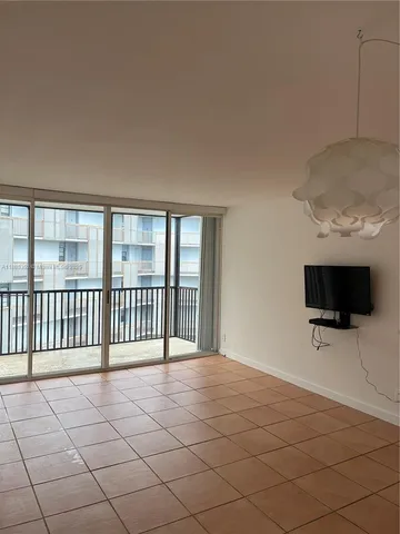 a view of a livingroom with a lounge chair