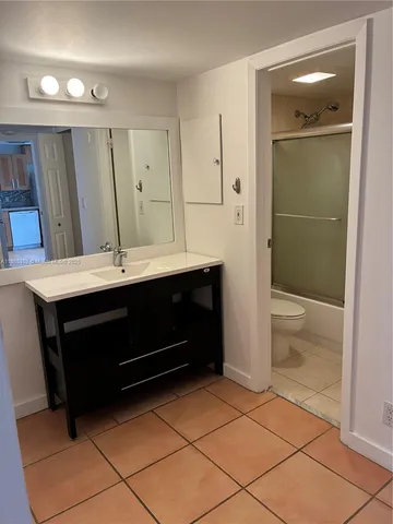 a room with a closet and mirror