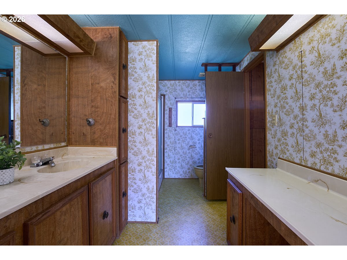 77846 Caudle Lane Lostine, OR 97857 - Photo 16 of 25 a bathroom with a sink and a mirror