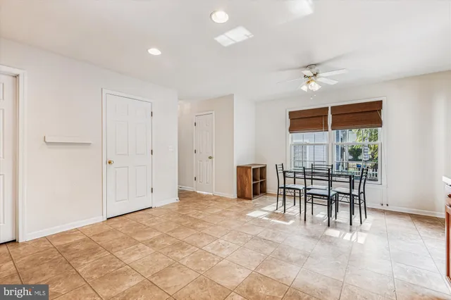 a view of a livingroom with furniture and a window