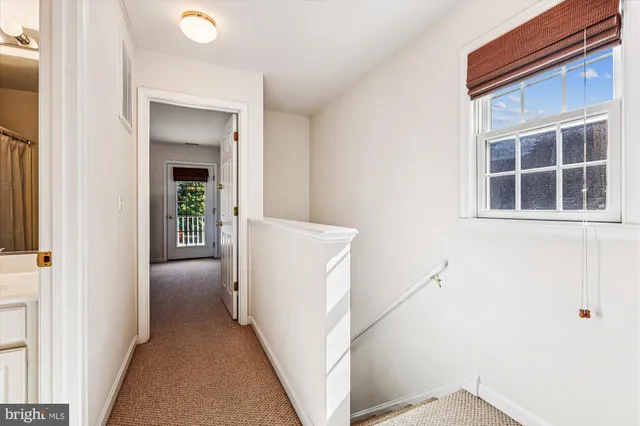 a view of a hallway with windows