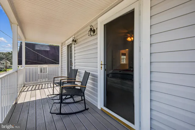a view of a balcony with furniture