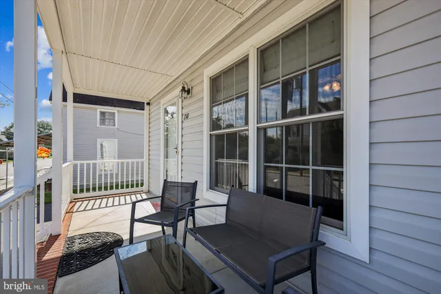 a view of a deck with table and chairs and wooden floor