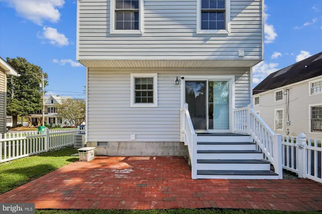 a view of a house with wooden floor and a yard