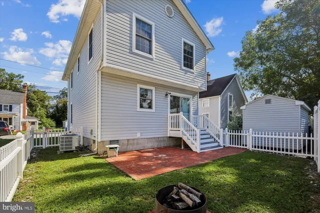 a view of a house with a yard and a garden