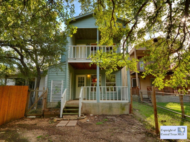 54 Deer Ridge Road Wimberley, TX 78676 - Photo 1 of 1 a front view of a house with a yard