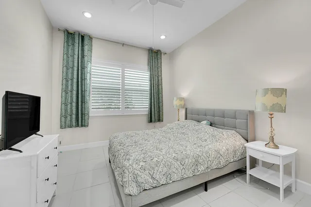 a bedroom with a bed and a view of bathroom