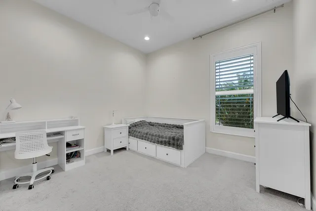 a utility room with washing machine and a view of bedroom