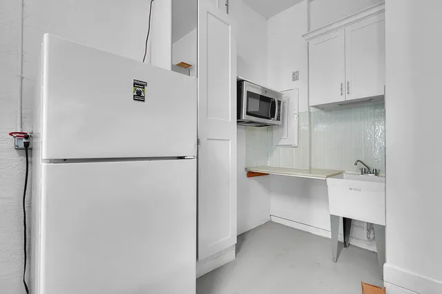 a view of a backyard with sitting area