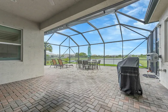 a front view of a house with a garden and plants