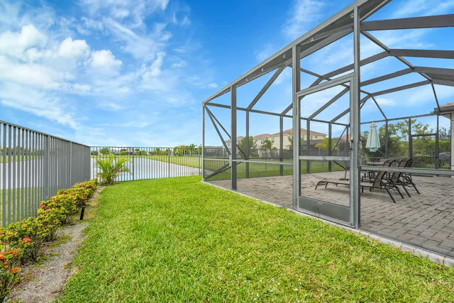 an aerial view of residential houses with outdoor space and city view