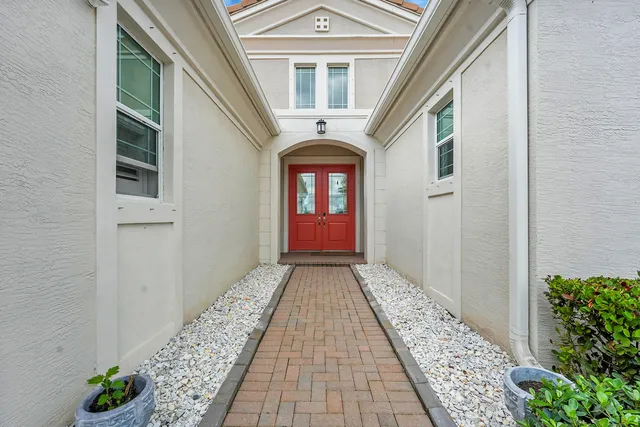 a view of entryway with flower pots