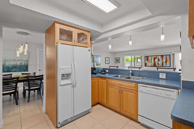a kitchen with appliances cabinets and furniture