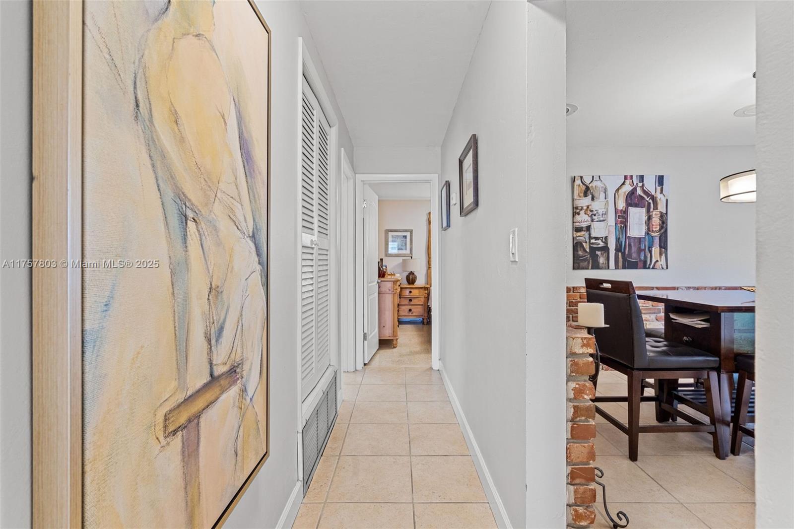6311 Southwest 93rd Court Miami, FL 33173 - Photo 20 of 41 a view of a hallway with paintings on the wall
