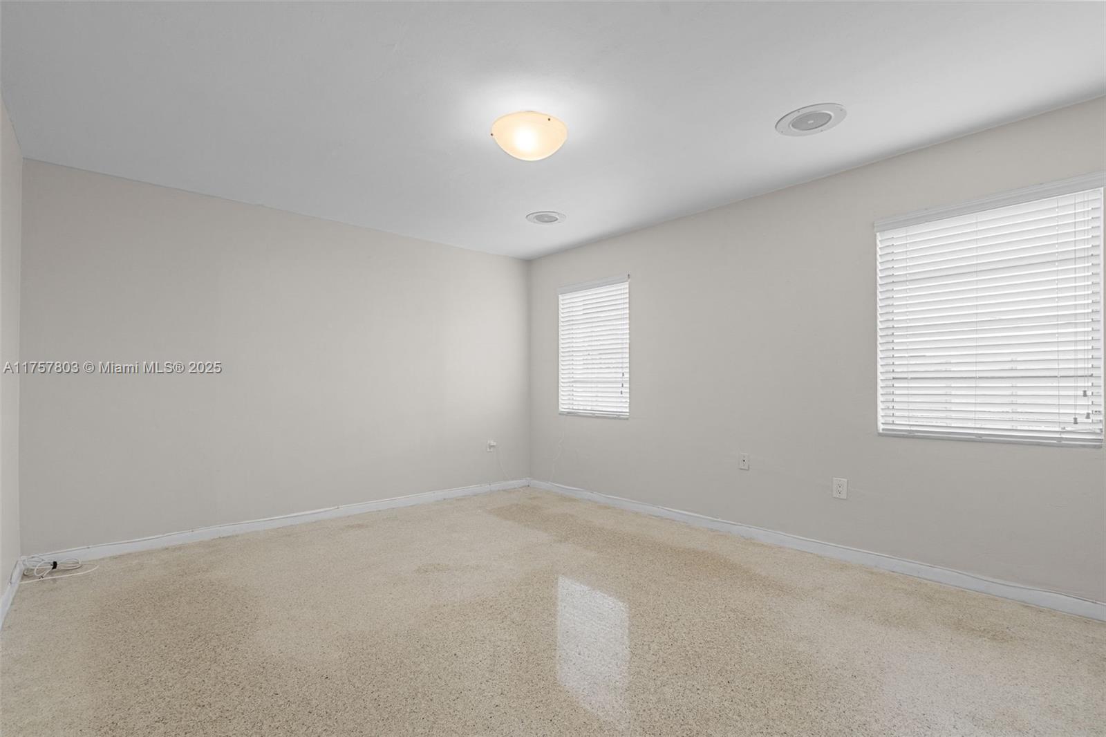 6311 Southwest 93rd Court Miami, FL 33173 - Photo 22 of 41 wooden floor in an empty room with a window