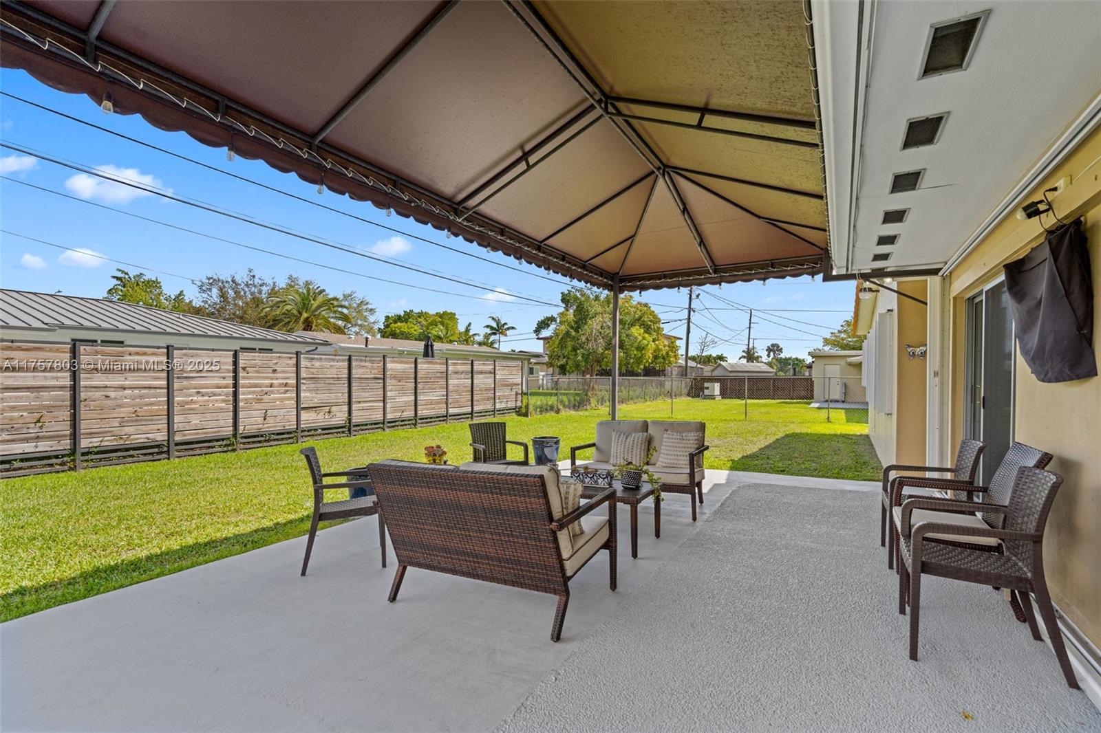 6311 Southwest 93rd Court Miami, FL 33173 - Photo 35 of 41 a view of a swimming pool with a couple of chairs