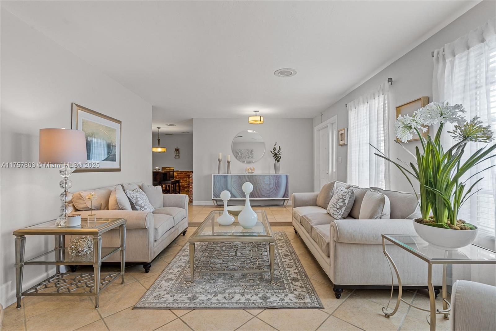 6311 Southwest 93rd Court Miami, FL 33173 - Photo 5 of 41 a living room with furniture potted plant and a window