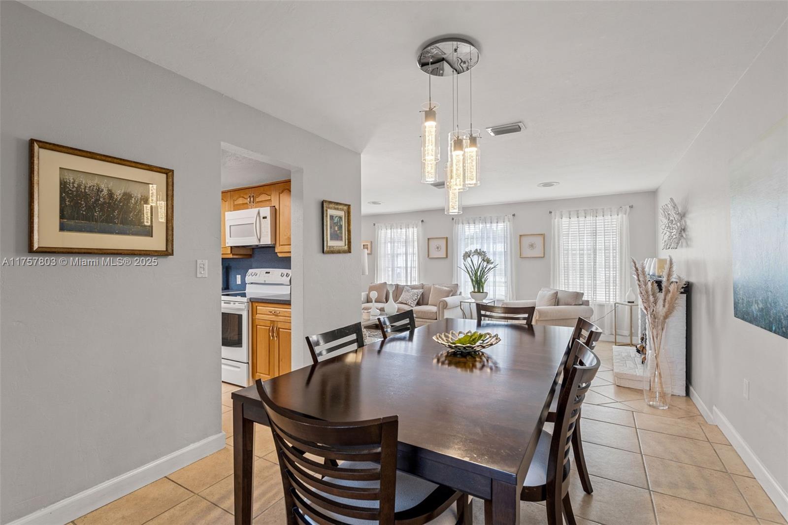 6311 Southwest 93rd Court Miami, FL 33173 - Photo 8 of 41 a view of a dining room with furniture