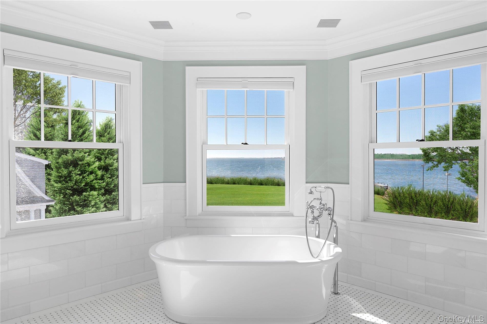 74 Cedar Lane West Remsenburg, NY 11960 - Photo 16 of 37 a bath tub sitting in a bathroom next to a window