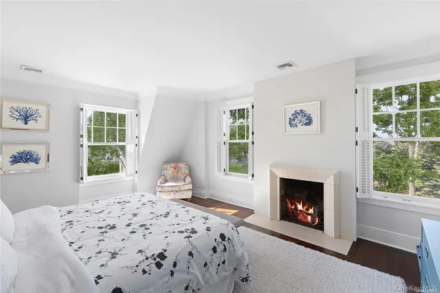 a bedroom with a bed and a fireplace