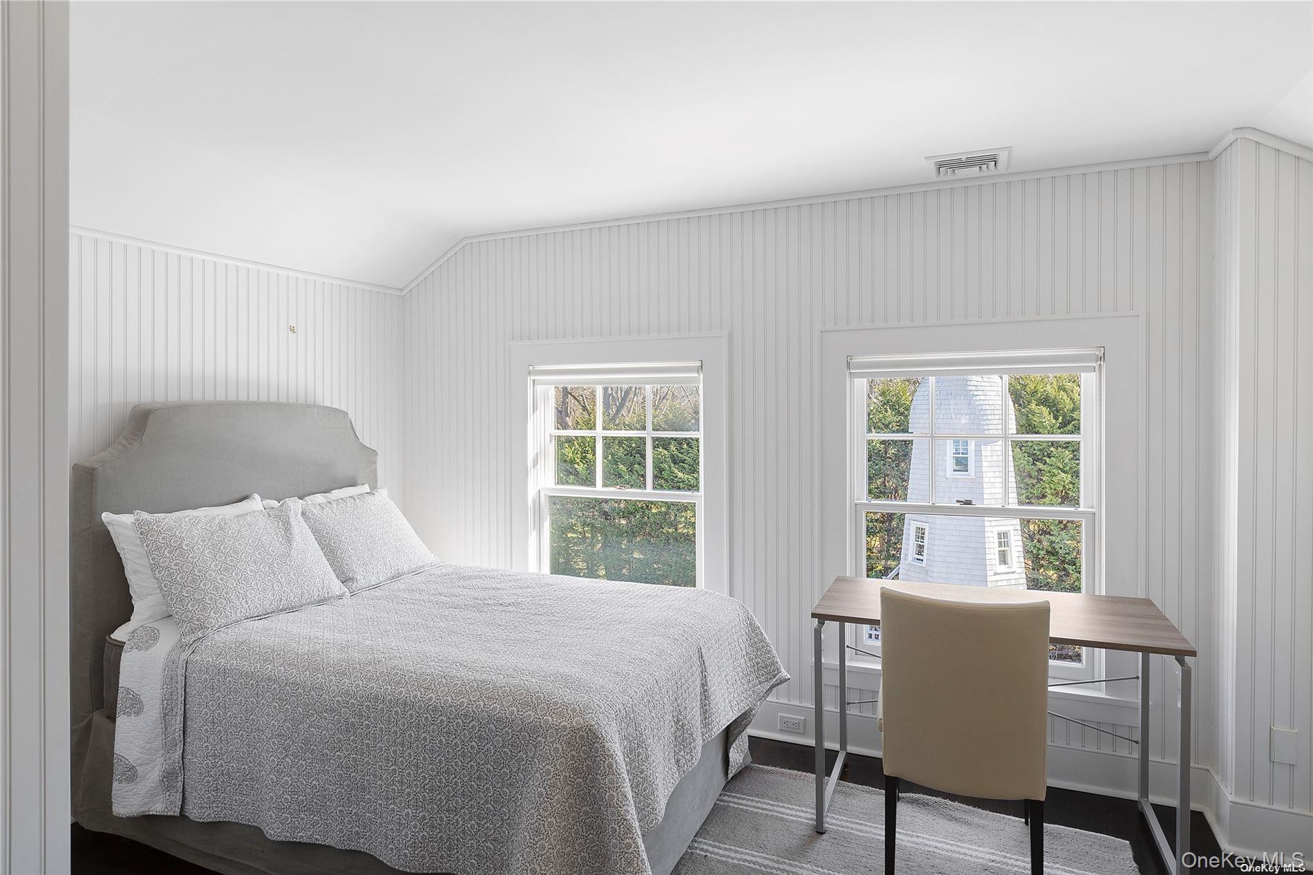 74 Cedar Lane West Remsenburg, NY 11960 - Photo 20 of 37 a bedroom with a bed and a window