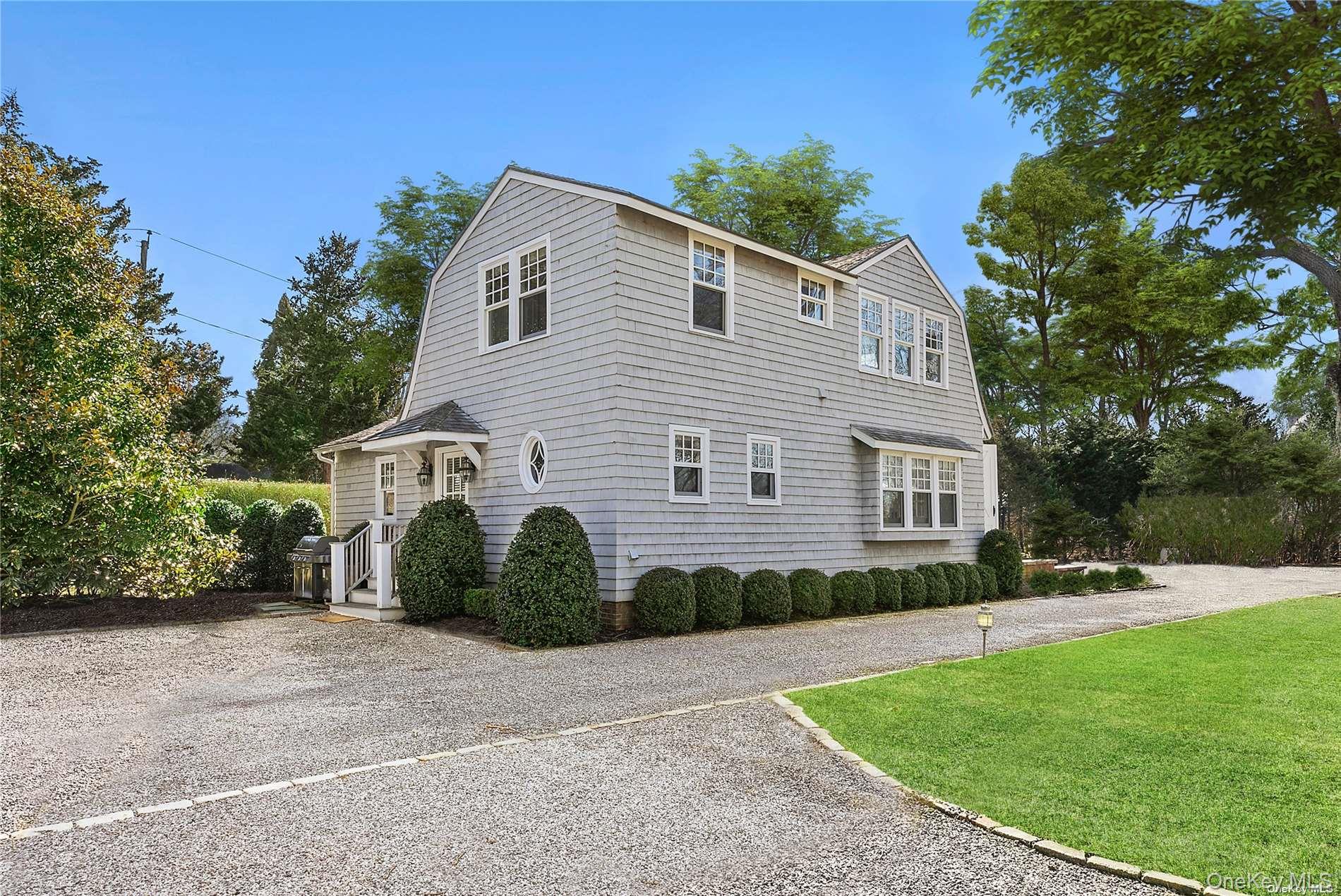 74 Cedar Lane West Remsenburg, NY 11960 - Photo 25 of 37 a front view of a house with a yard