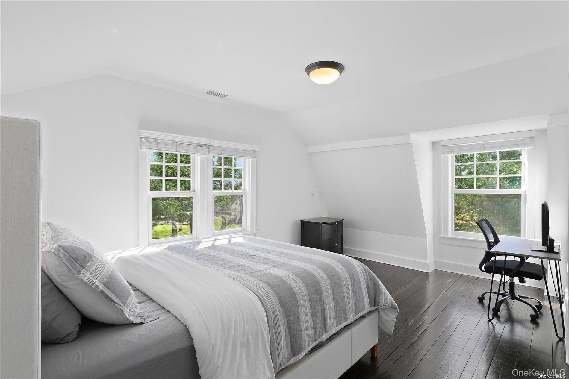 74 Cedar Lane West Remsenburg, NY 11960 - Photo 28 of 37 a bedroom with a bed and a desk