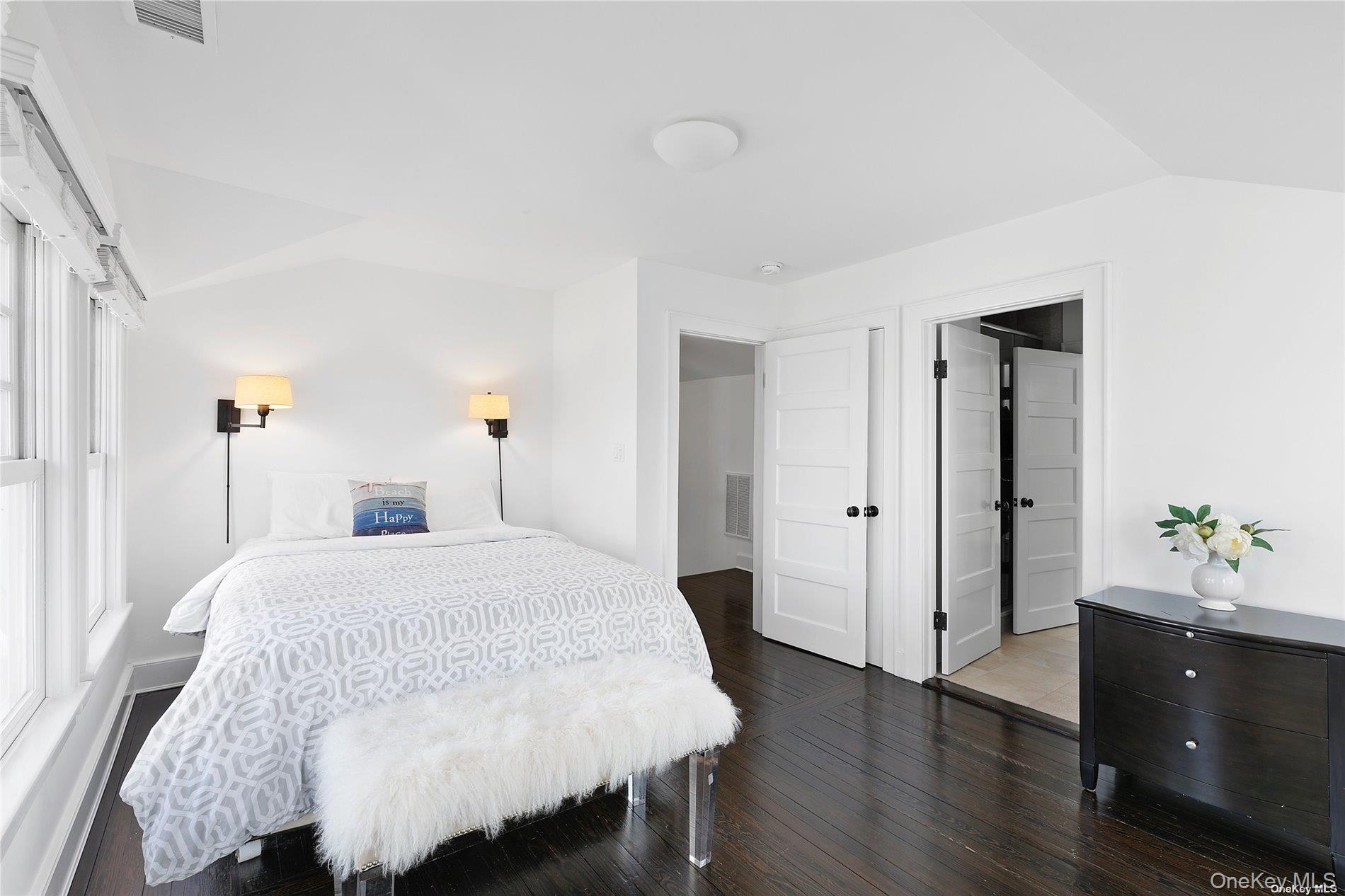 74 Cedar Lane West Remsenburg, NY 11960 - Photo 29 of 37 a bedroom with a bed and wooden floor