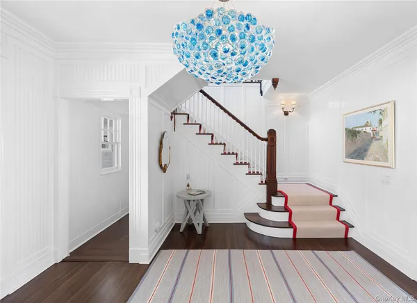 a view of entryway with wooden floor
