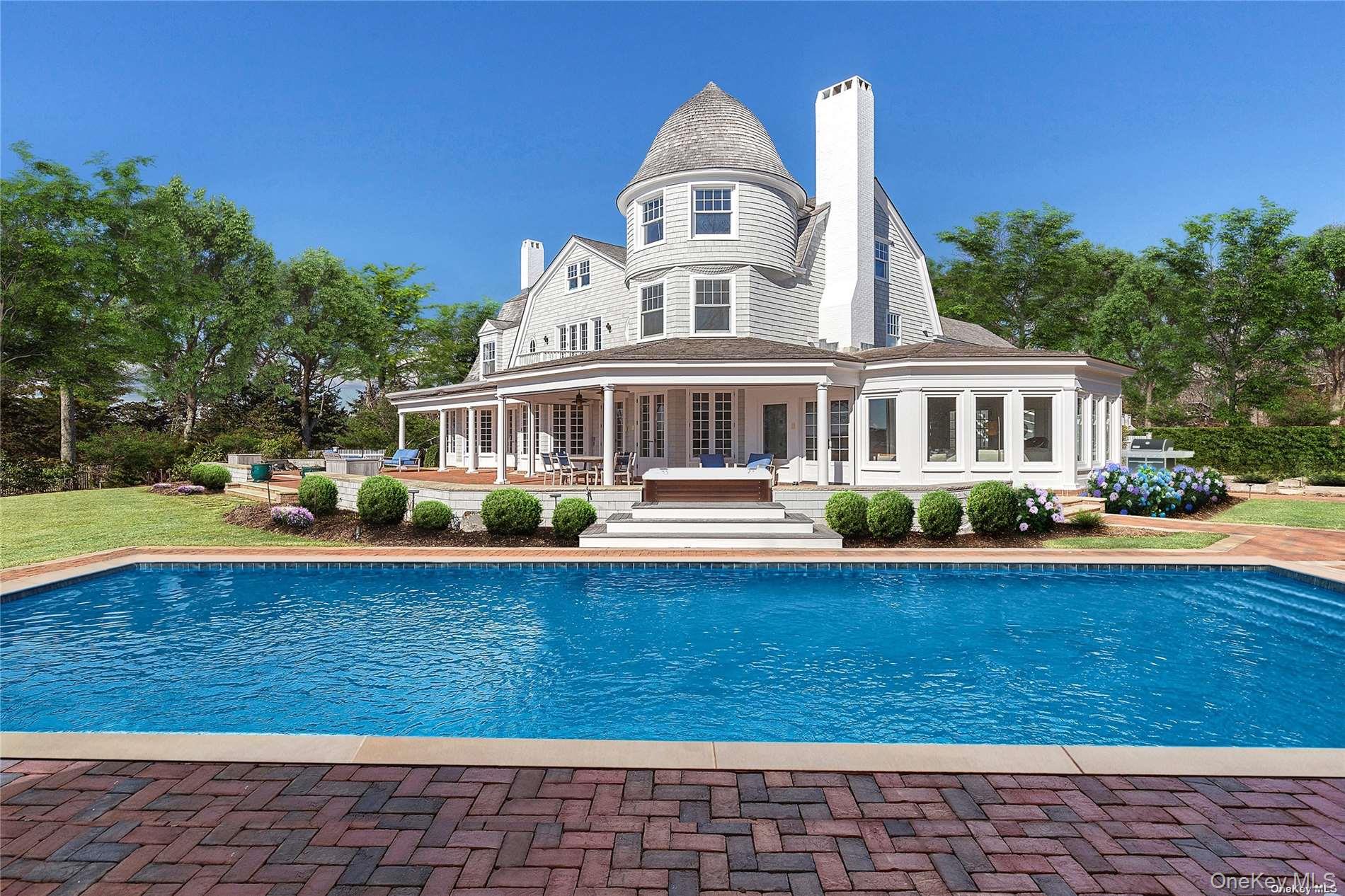74 Cedar Lane West Remsenburg, NY 11960 - Photo 34 of 37 a front view of a house with yard and green space