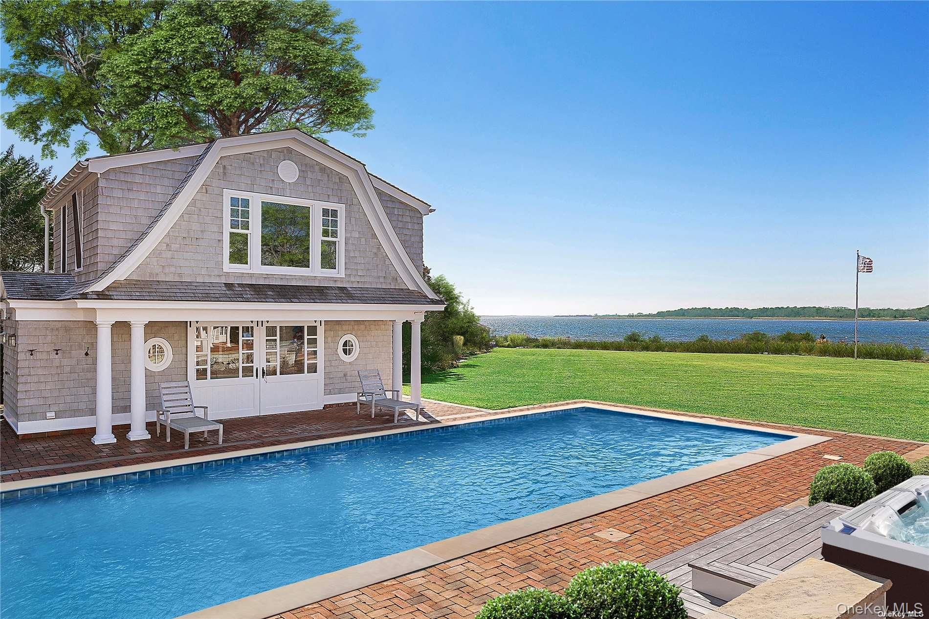 74 Cedar Lane West Remsenburg, NY 11960 - Photo 35 of 37 a front view of a house with a yard