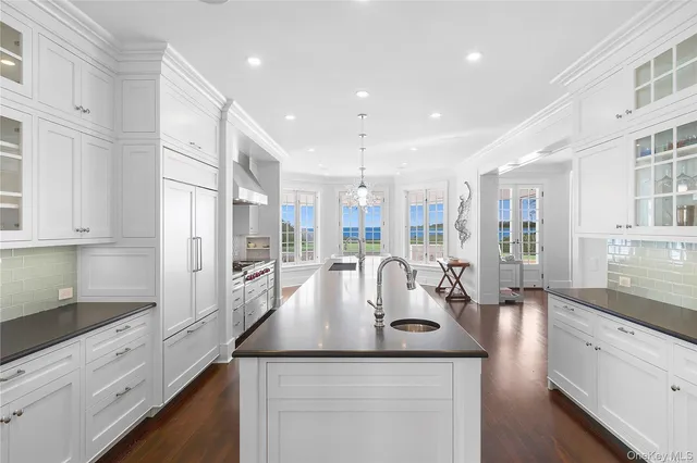 a kitchen with counter top space a sink and cabinets