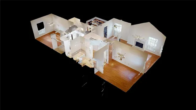 an aerial view of a house with outdoor space