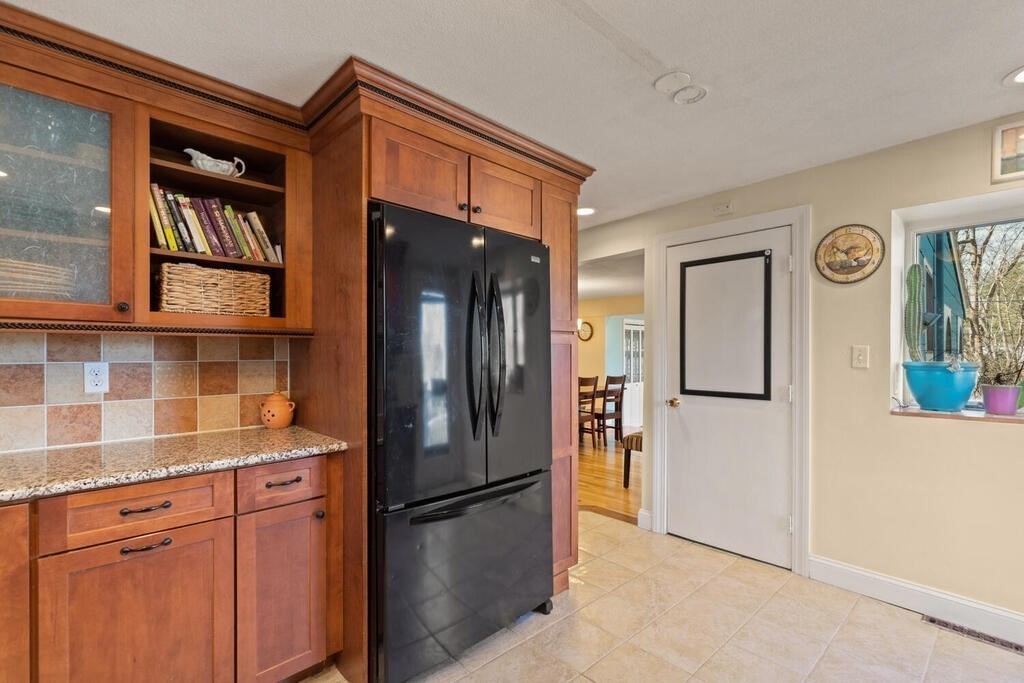 73 Longfellow Road Reading, MA 01867 - Photo 16 of 32 a kitchen with stainless steel appliances granite countertop a refrigerator and a sink