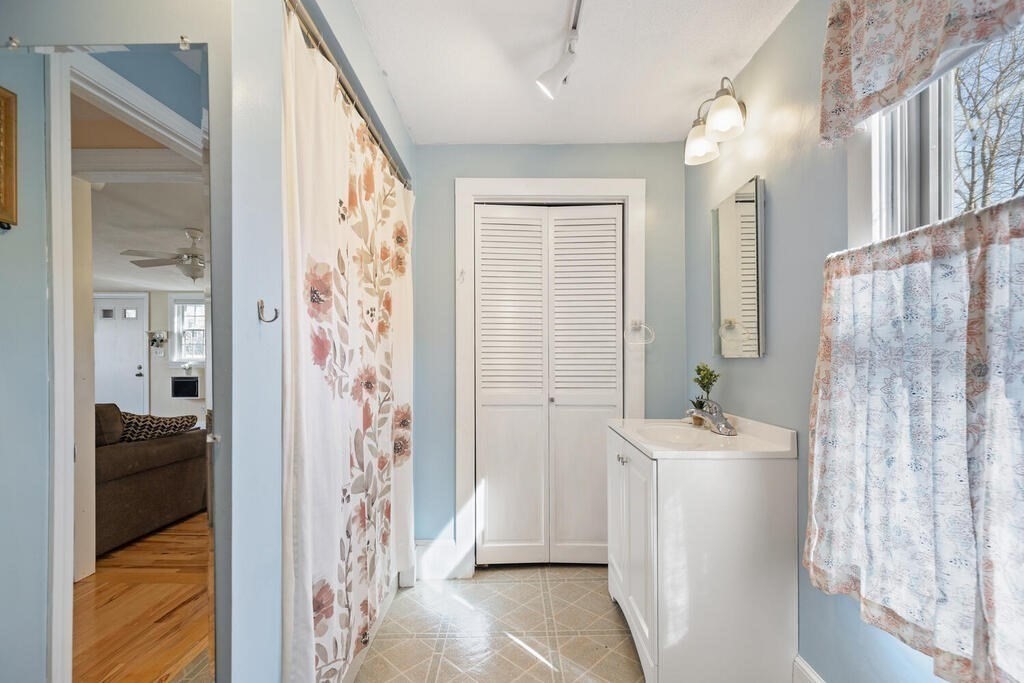 73 Longfellow Road Reading, MA 01867 - Photo 18 of 32 a bathroom with a sink a toilet and a shower