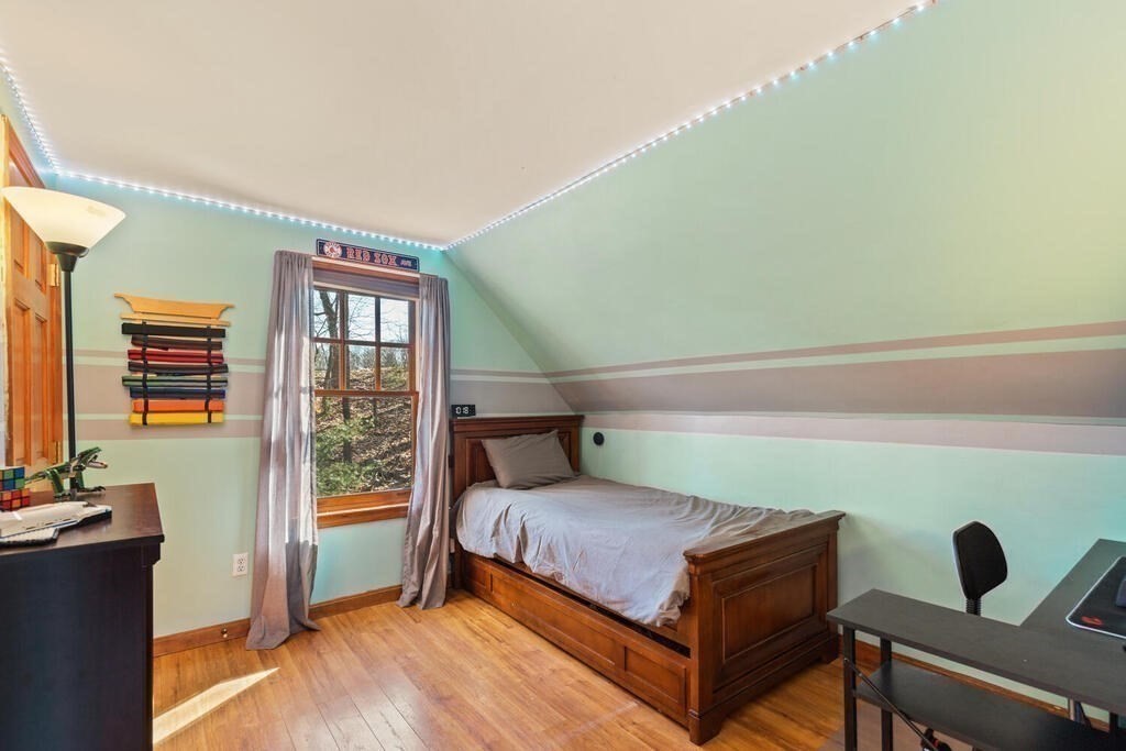 73 Longfellow Road Reading, MA 01867 - Photo 20 of 32 a bedroom with a bed and a window