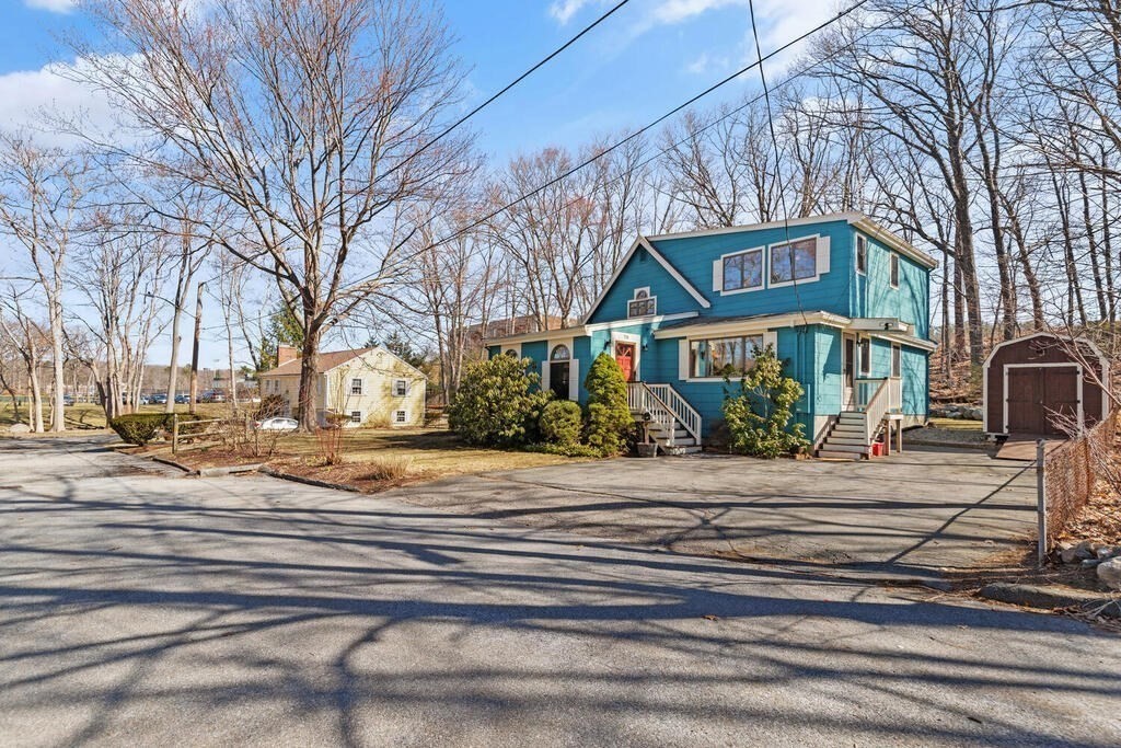73 Longfellow Road Reading, MA 01867 - Photo 2 of 32 a front view of a house with a garden
