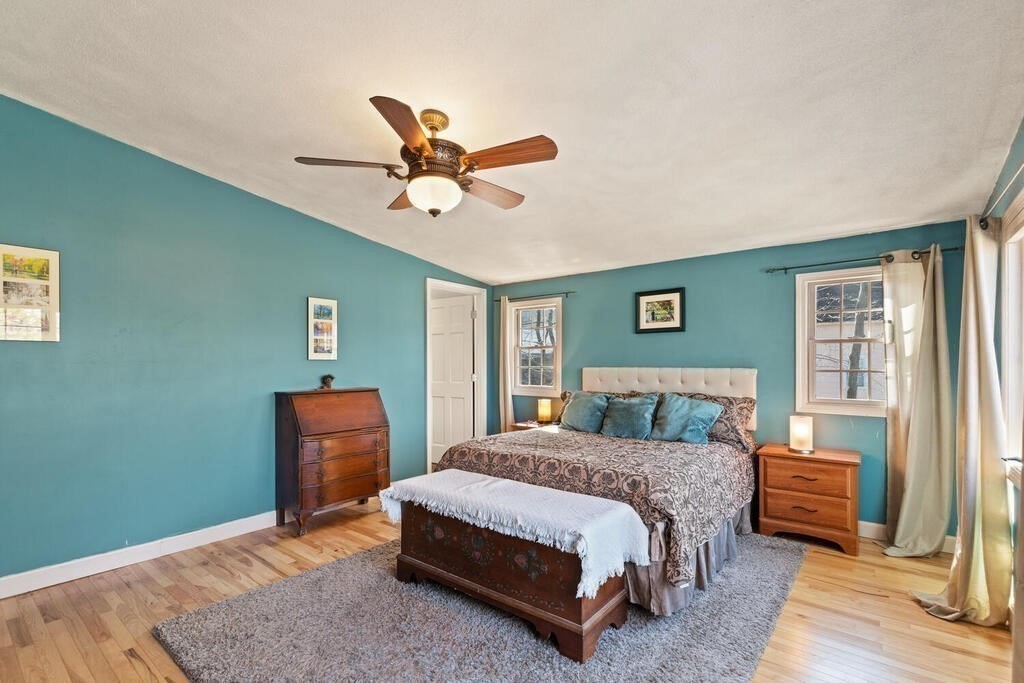 73 Longfellow Road Reading, MA 01867 - Photo 22 of 32 a bedroom with a bed and a window