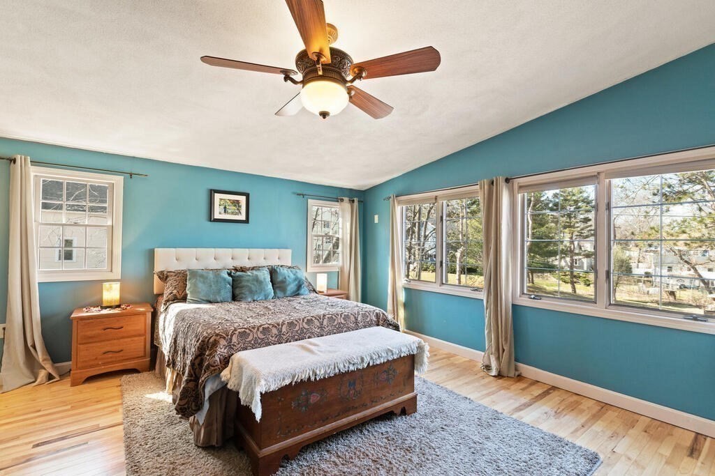 73 Longfellow Road Reading, MA 01867 - Photo 23 of 32 a bedroom with a large bed and a window