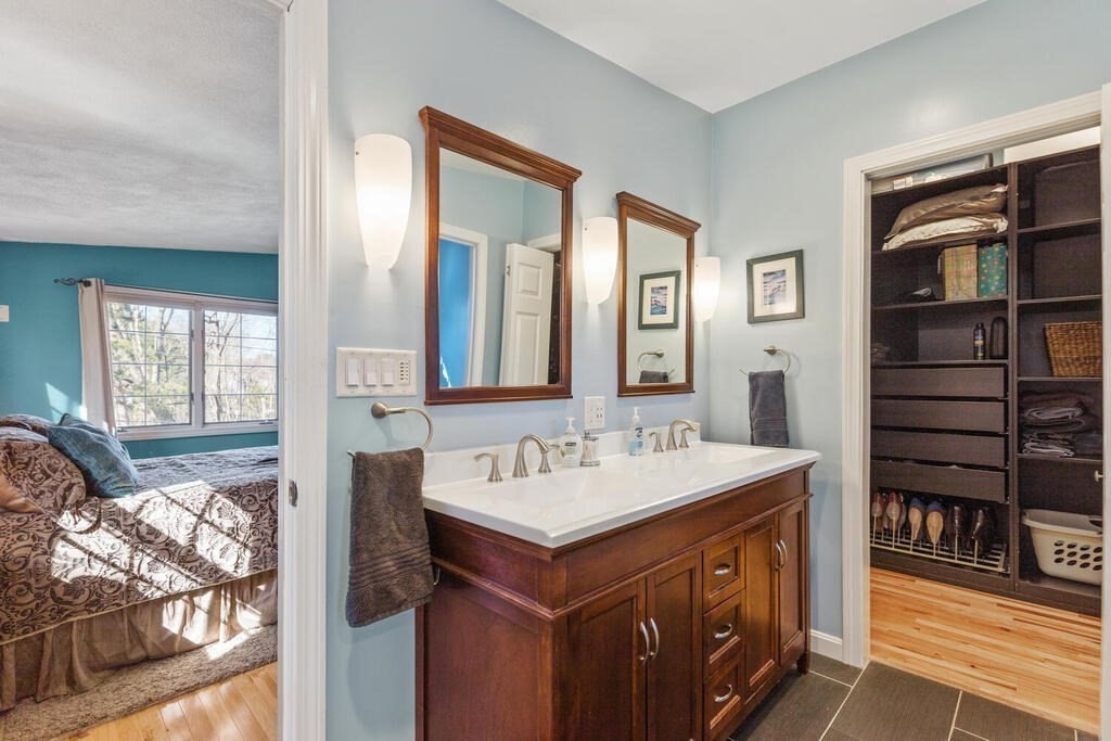 73 Longfellow Road Reading, MA 01867 - Photo 25 of 32 a bathroom with a sink double vanity and a mirror