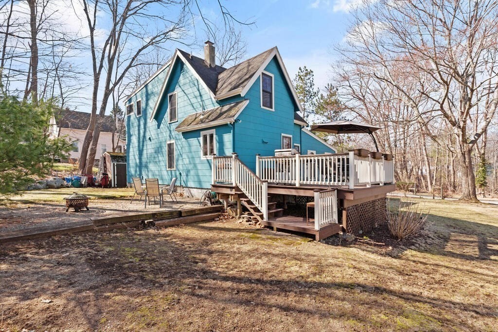 73 Longfellow Road Reading, MA 01867 - Photo 29 of 32 a front view of a house with a yard