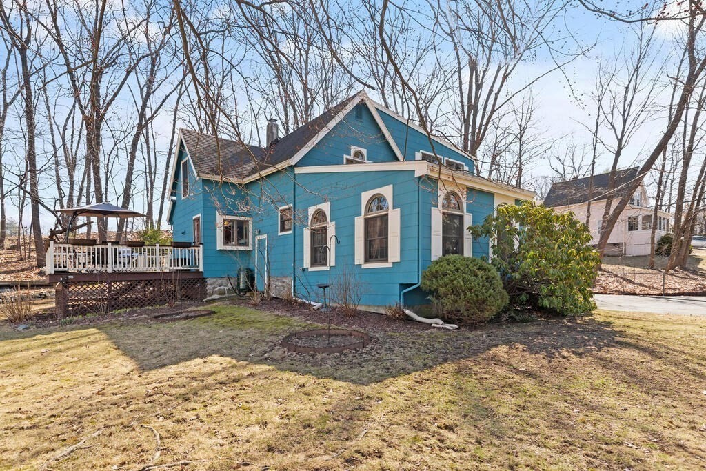73 Longfellow Road Reading, MA 01867 - Photo 30 of 32 a front view of a house with a yard