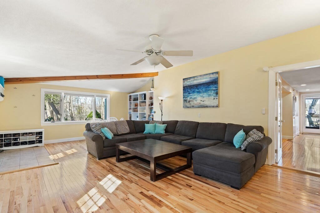 73 Longfellow Road Reading, MA 01867 - Photo 5 of 32 a living room with furniture and a window