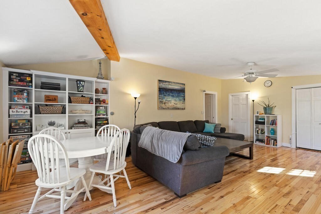 73 Longfellow Road Reading, MA 01867 - Photo 7 of 32 a living room with furniture and a book shelf