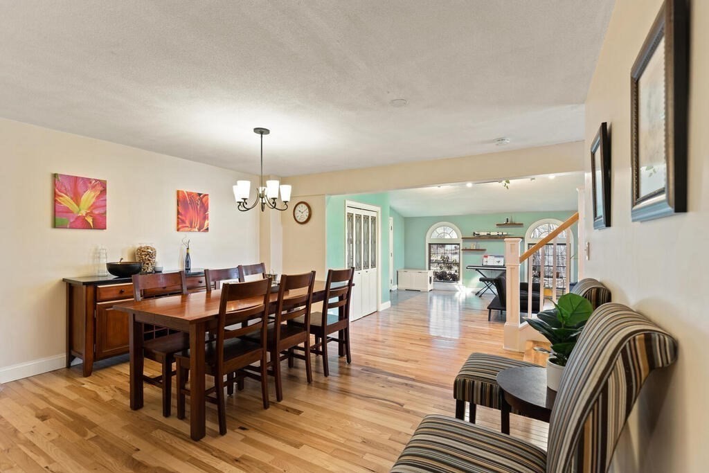 73 Longfellow Road Reading, MA 01867 - Photo 10 of 32 a view of a dining room with furniture window and wooden floor