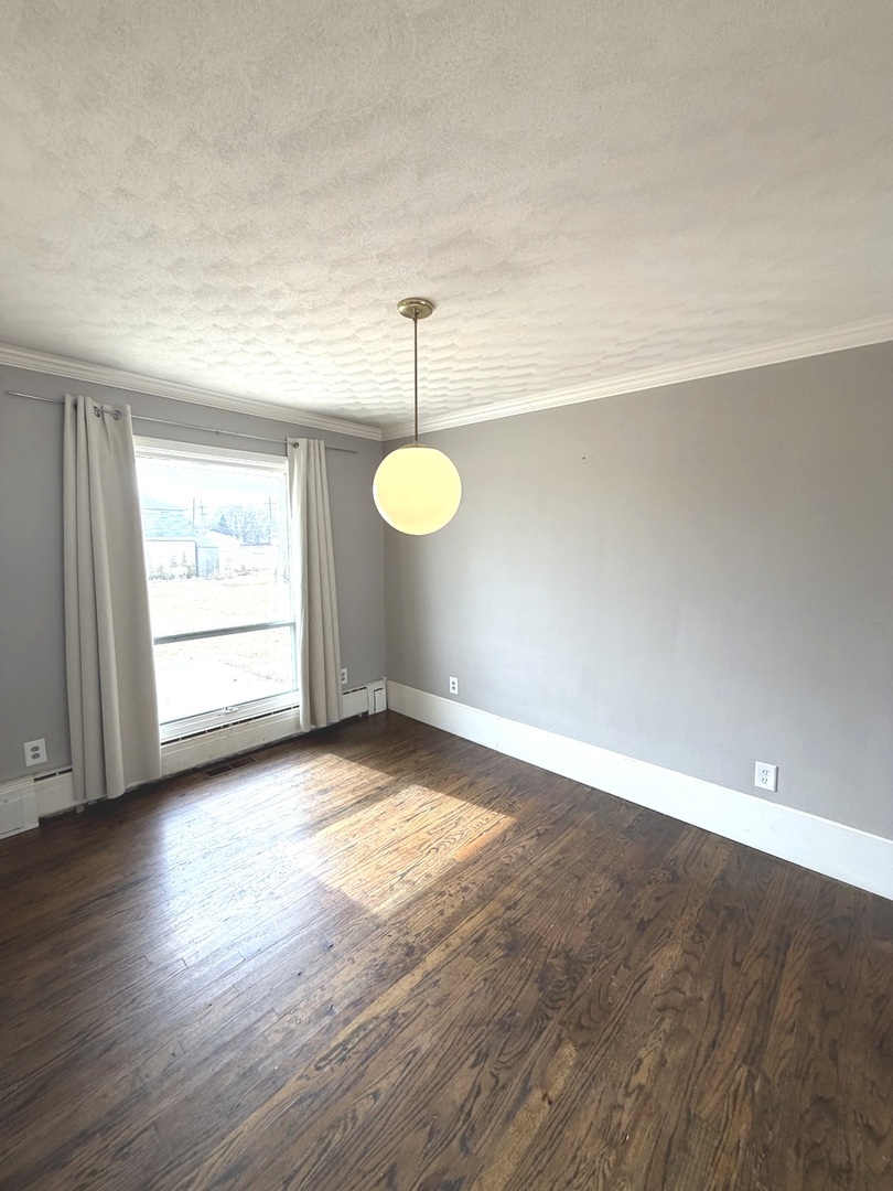 401 North Street Mazon, IL 60444 - Photo 11 of 23 a view of a livingroom with wooden floor and window