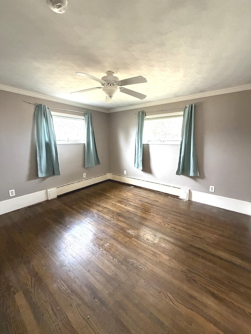 401 North Street Mazon, IL 60444 - Photo 15 of 23 an empty room with wooden floor and windows