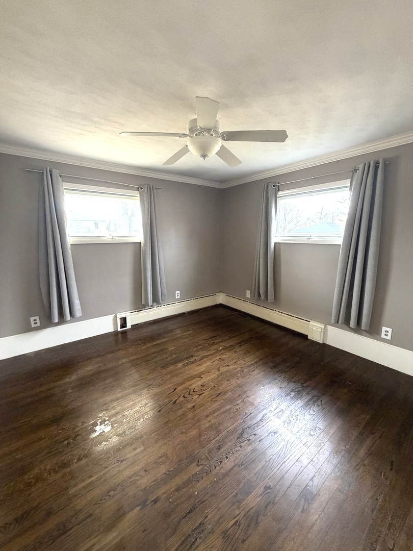 401 North Street Mazon, IL 60444 - Photo 17 of 23 an empty room with wooden floor and windows